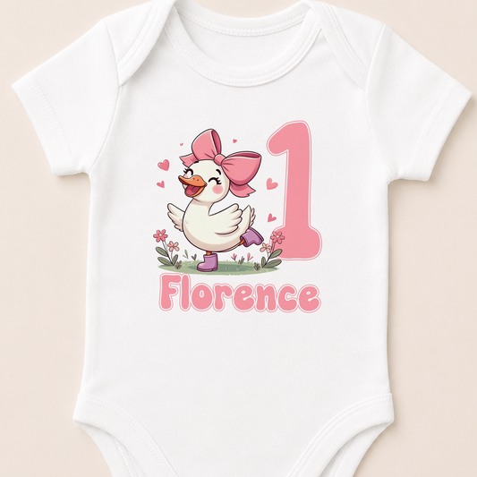 Personalised silly goose 1st birthday sleepsuit, printed with your baby girl's name and a pink bow.