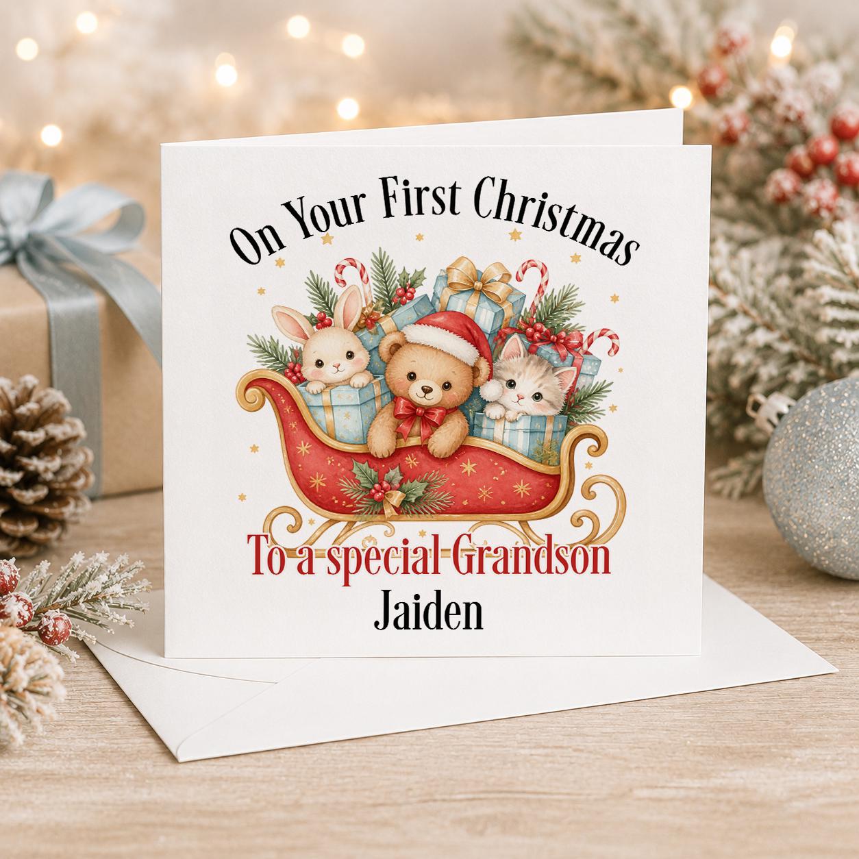 Personalised baby first Christmas card, white 6x6 inch square card printed with two animals in a red sleigh of presents and a name