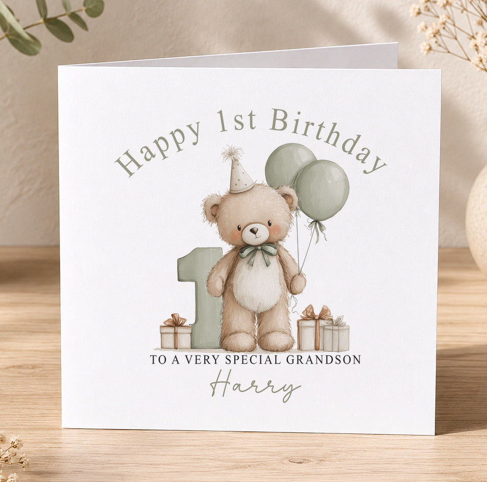 Personalised first birthday card featuring a teddy bear and balloons, printed with the recipient's name and relation