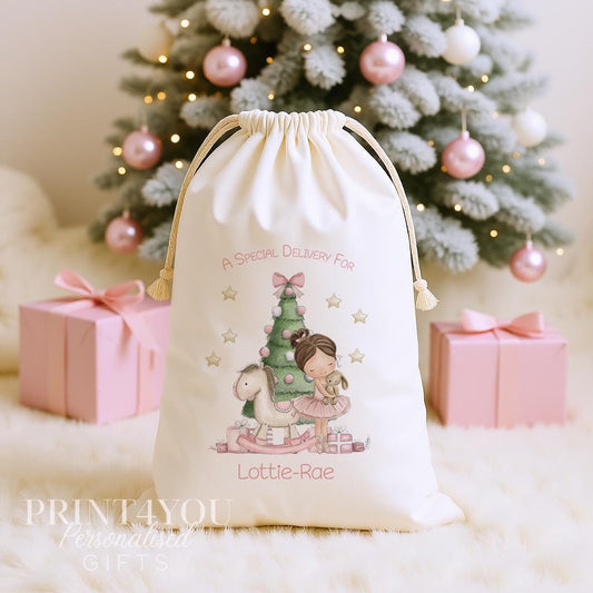 Personalised ballerina Christmas sack, cream cotton drawstring santa sack printed with a ballerina in a pink tutu beside a Christmas tree and a name