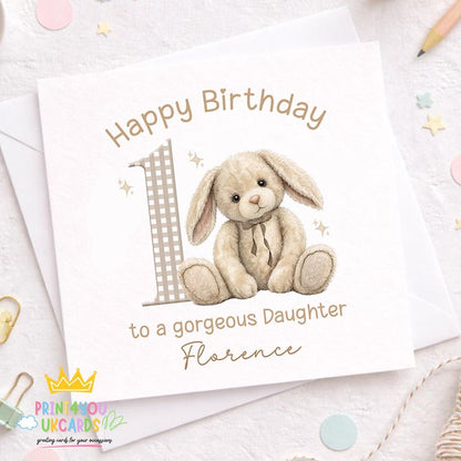 Front view of the beige bunny personalised birthday card with name and age on a plain background.