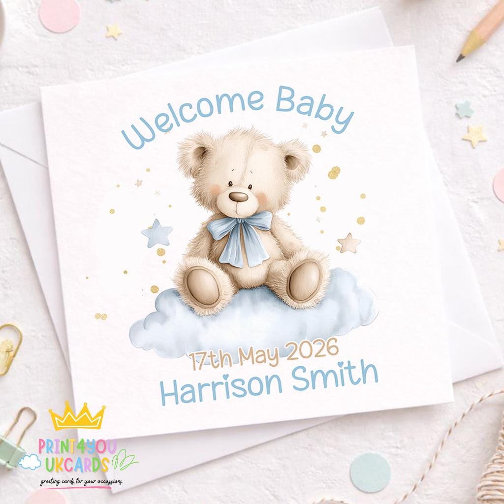 Front view of the teddy bear on a cloud new baby boy card on a plain background.