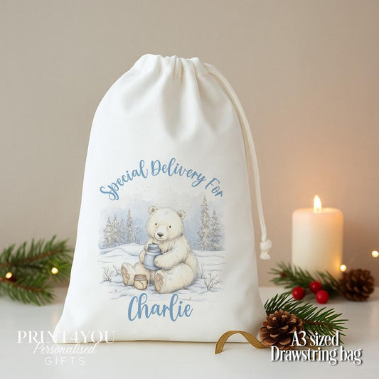 Personalised polar bear Christmas sack, white A3 drawstring gift bag printed with a polar bear cub in the snow and Special Delivery For a name