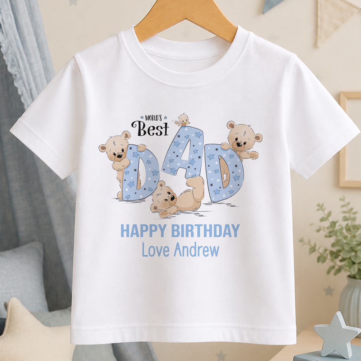 A white t-shirt with a graphic design featuring a group of teddy bears and the text "WORLD'S BEST DAD HAPPY BIRTHDAY Love Andrew" printed on it.