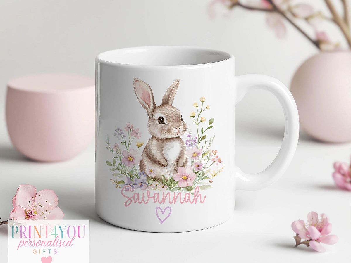 Ceramic mug with a pink handle, personalised with a name and printed with a bunny rabbit design