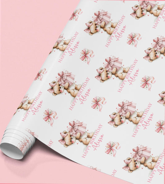 Personalised teddy bear birthday wrapping paper featuring a cute teddy holding a pink present, custom name and birthday message for girls.