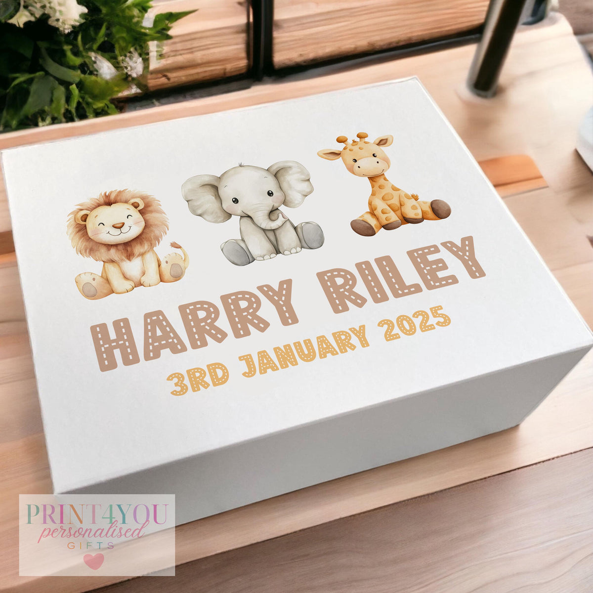 White magnetic-close keepsake box for a baby's first birthday, personalised with the child's name and printed with a unisex safari animal design, shown in the medium 160 x 200 x 80mm size