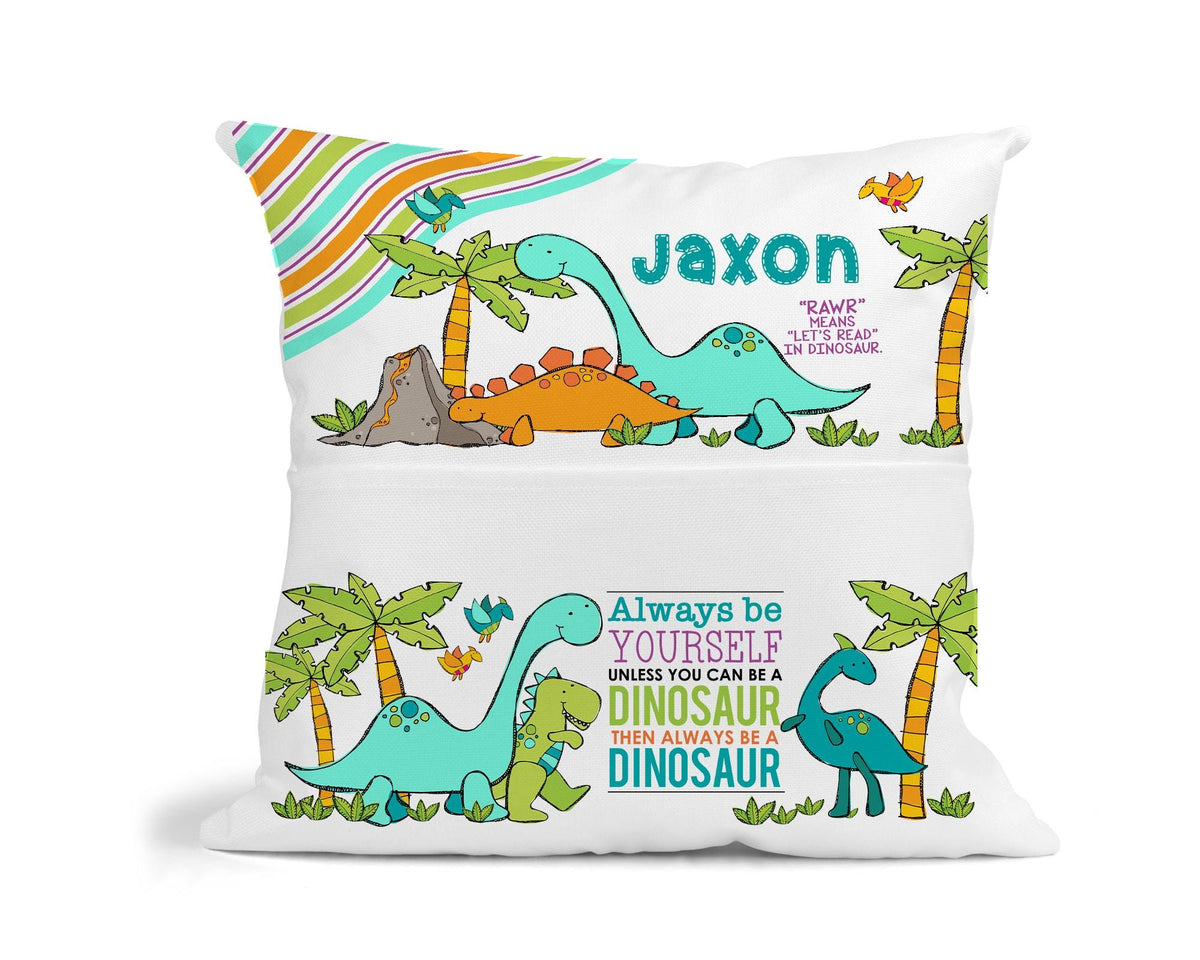 Close-up of personalised dinosaur cushion design showing child's name