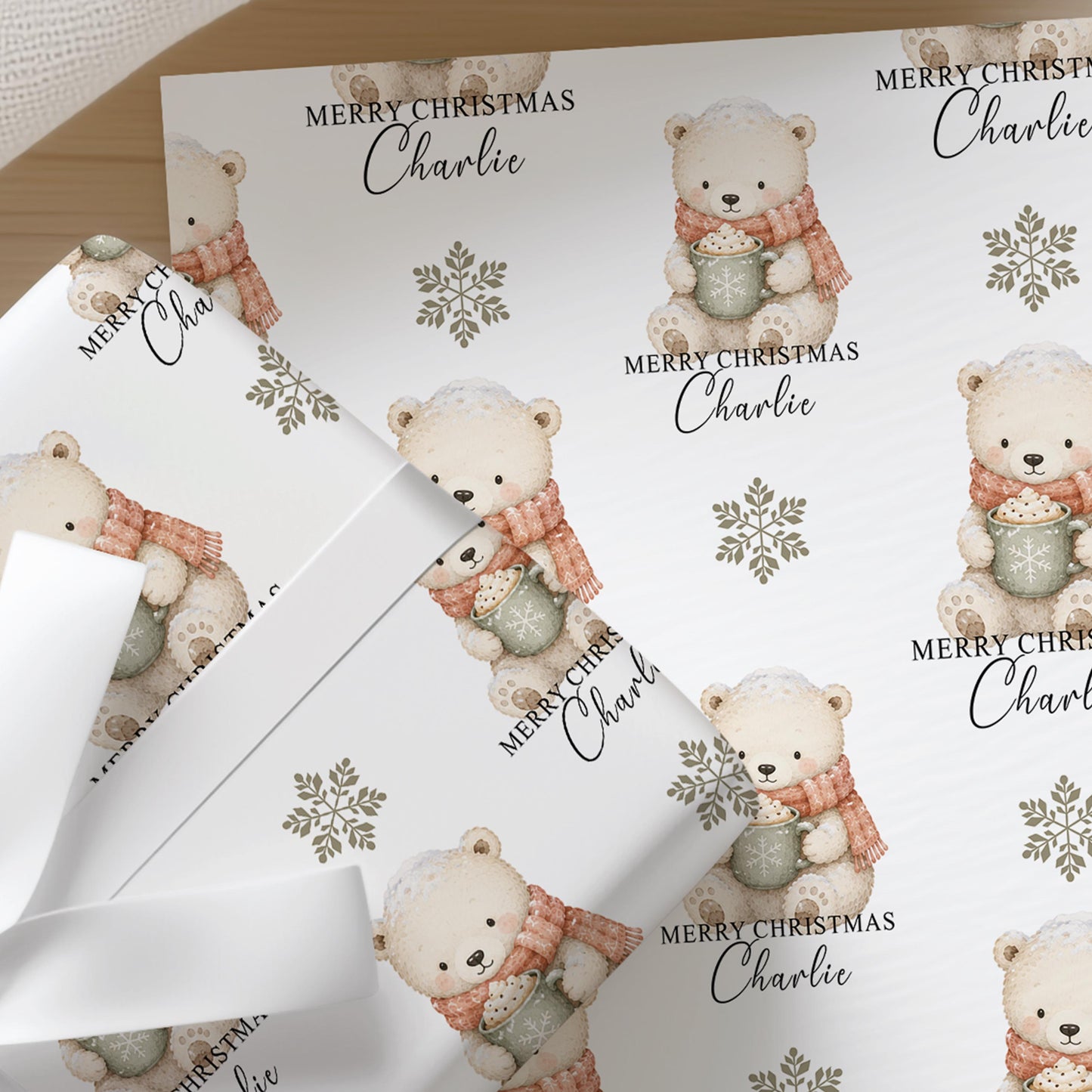 Personalised polar bear Christmas wrapping paper roll with custom name printed into the repeating design