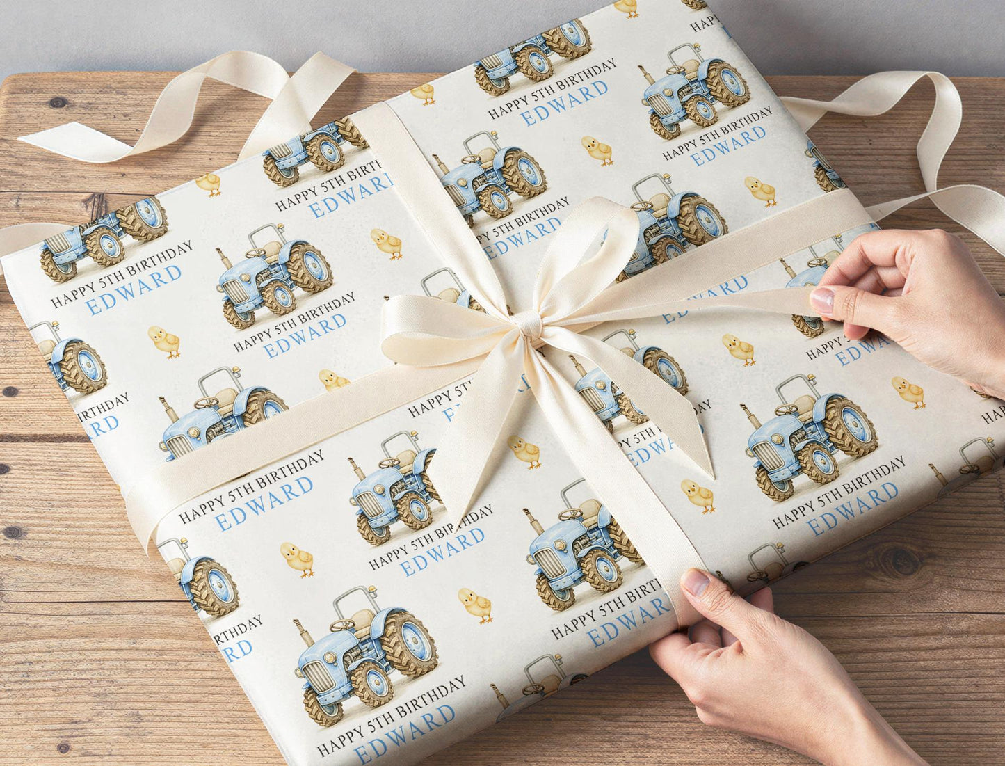 Section of the personalised tractor wrapping paper showing the tractor print and personalisation