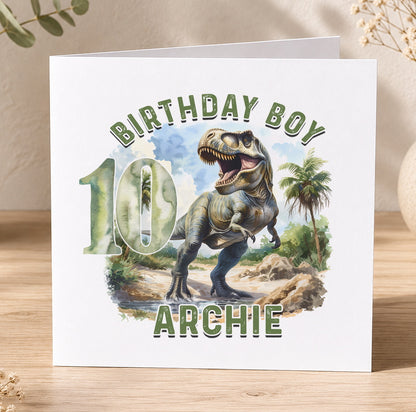 Personalised T-Rex dinosaur birthday card example showing custom name and age printed in the jungle design