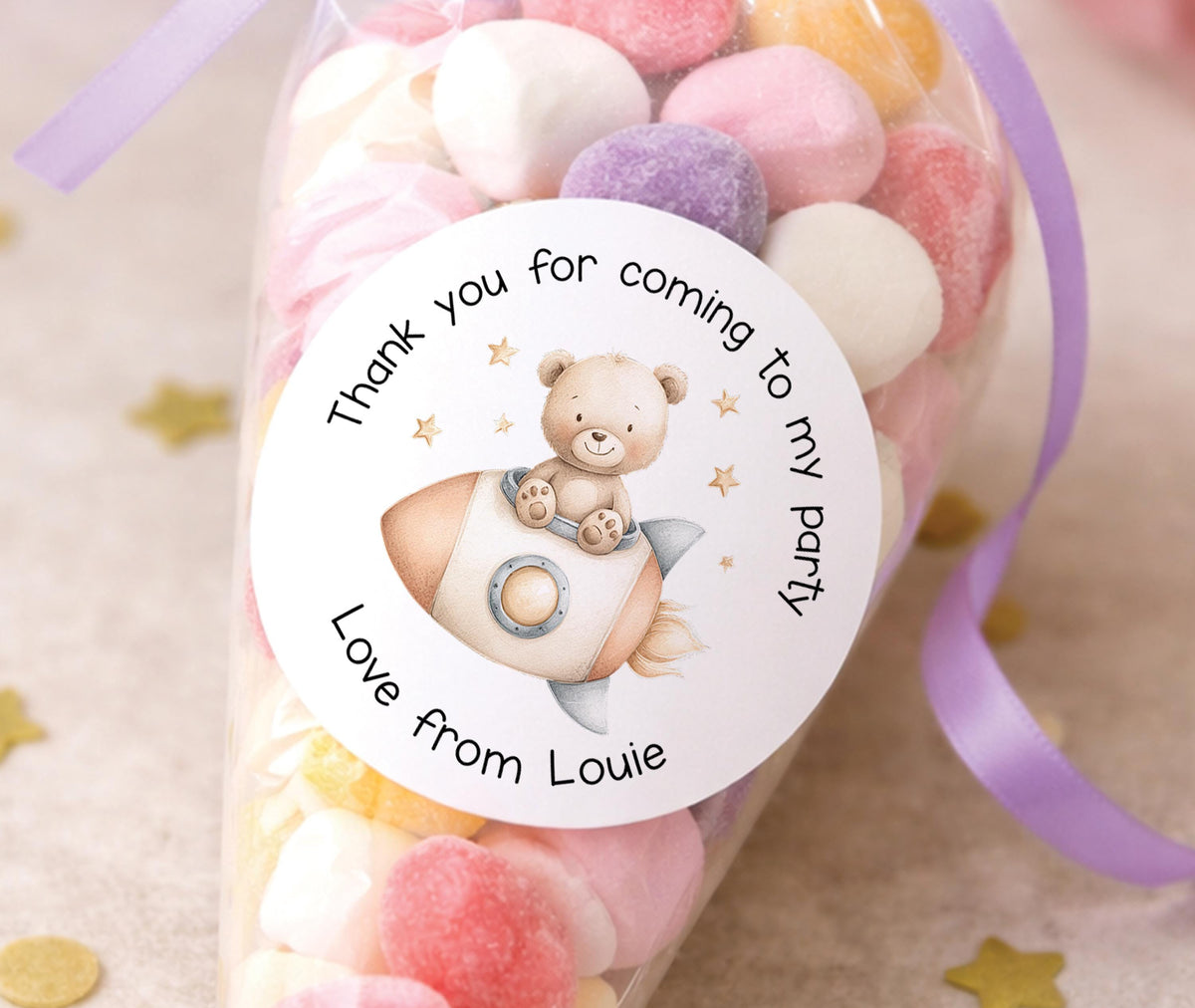 Sheet of glossy round space rocket stickers, personalised with a child's name