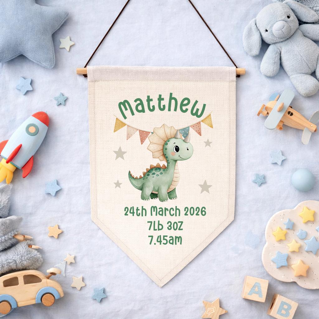 Dinosaur-themed nursery pennant print personalised with baby name and birth stats