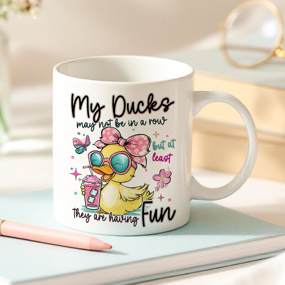 Side view of the Get Your Ducks in a Row mug showing the pink handle option