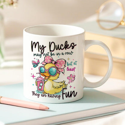 Side view of the Get Your Ducks in a Row mug showing the pink handle option