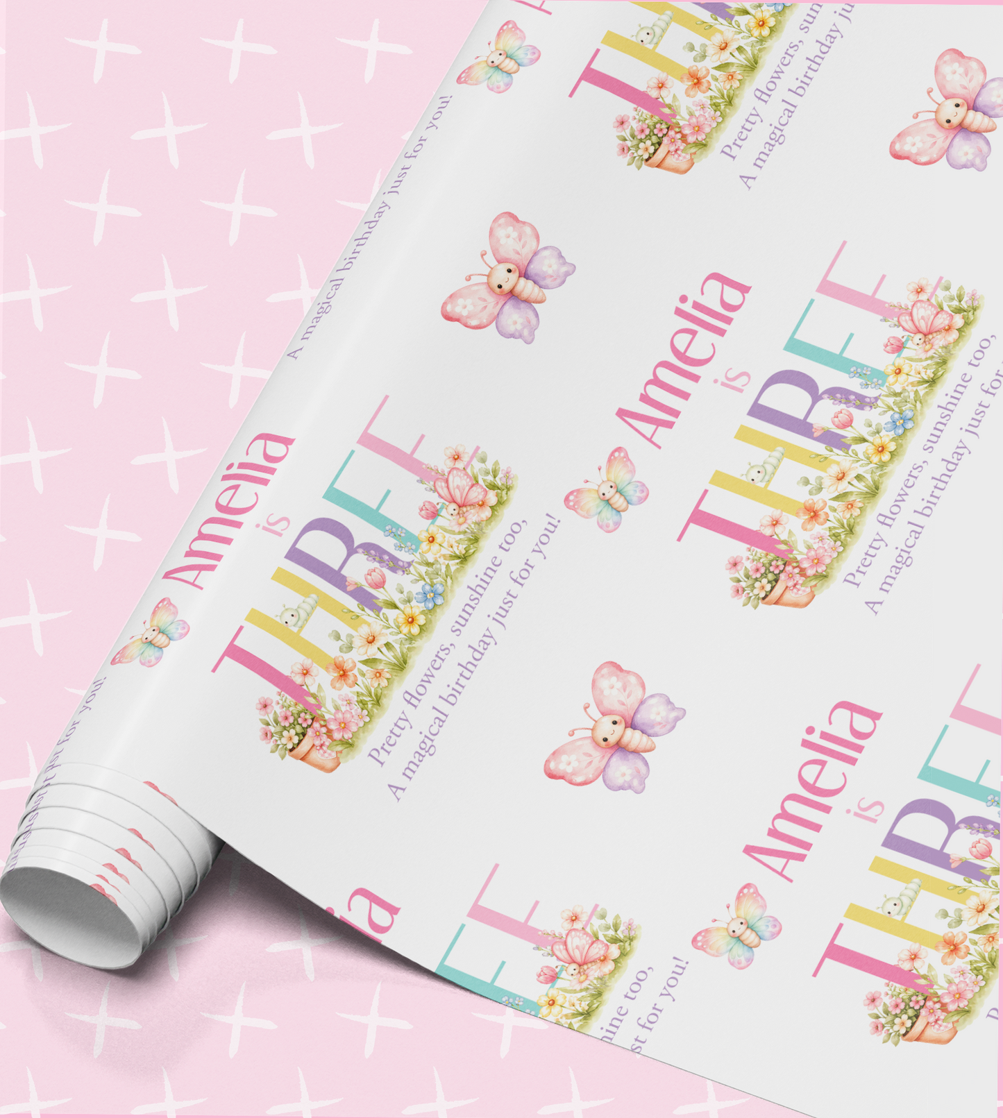 The image is a roll of wrapping paper with a repeating pattern of butterflies and flowers, along with the name "Amelia" printed on it.