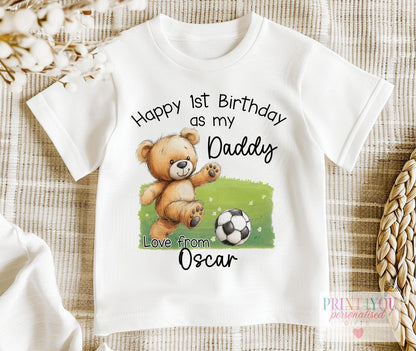 White baby bib personalised with a teddy bear football first birthday design for Daddy, with baby's name underneath