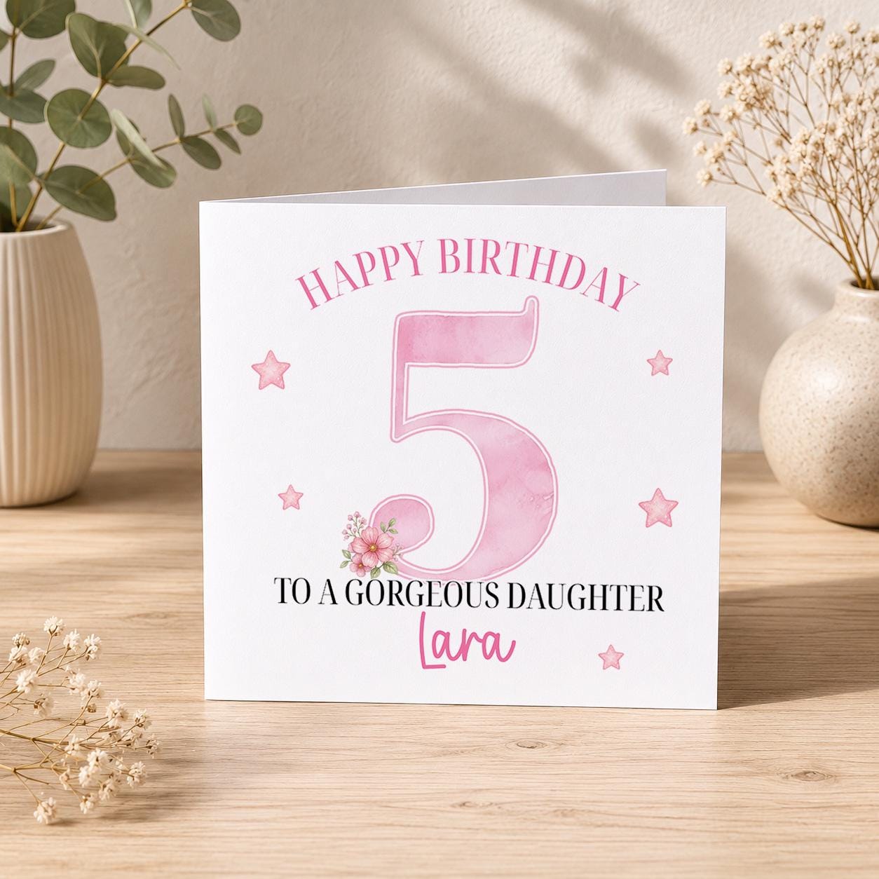Square personalised birthday card featuring a large pink number design, with space for a girl's printed name and age