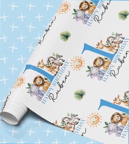 The image is a birthday wrapping paper with a repeating pattern of cartoon animal illustrations, including elephants, lions, and zebras, along with the text "Happy Birthday Ruben".