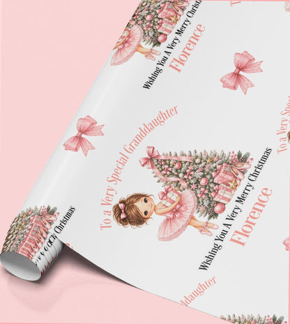 Rolled sheet of personalised ballerina Christmas wrapping paper with a name and relation wording