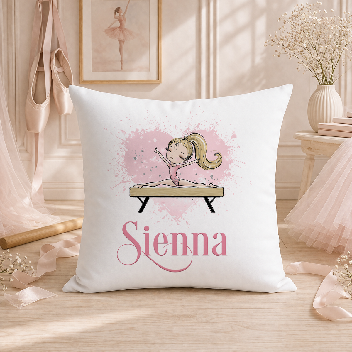Personalised gymnastics cushion cover with blonde gymnast doing the splits on a beam, pink heart background.