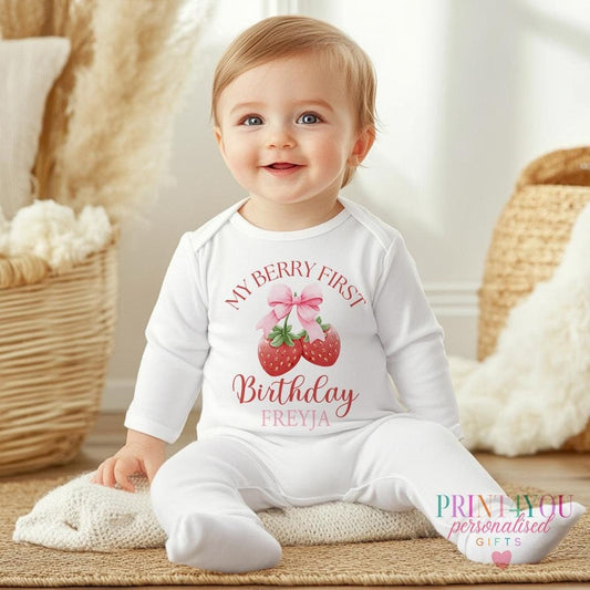Personalised My Berry first birthday outfit printed with a strawberry and bow design and the baby's name and age.