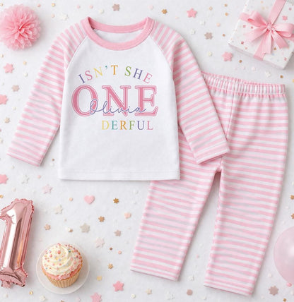 Close-up of the pink stripe print showing the personalised name detail on the pyjama top.