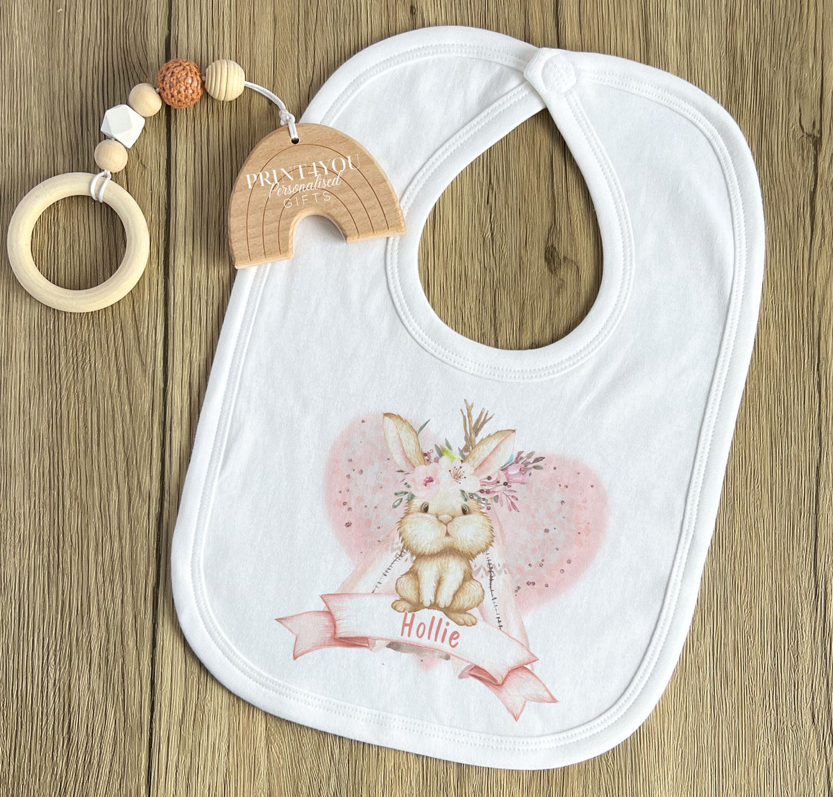 Close-up of the boho rabbit in a heart design printed on the personalised baby bib.