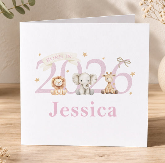 Pink newborn baby card illustrated with a baby elephant, giraffe and lion, printed with 'Born in 2026 Jessica' as a personalisation example.