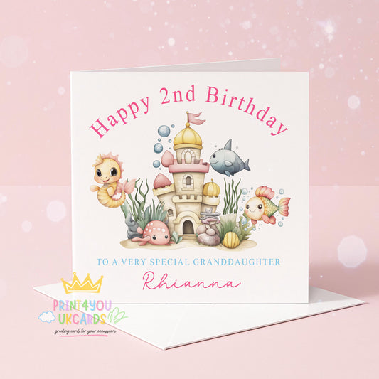 Front view of the personalised under the sea birthday card showing a pastel ocean castle scene with seahorses and fish.