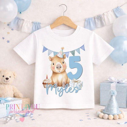 Personalised capybara birthday t-shirt with custom name and age printed on white cotton