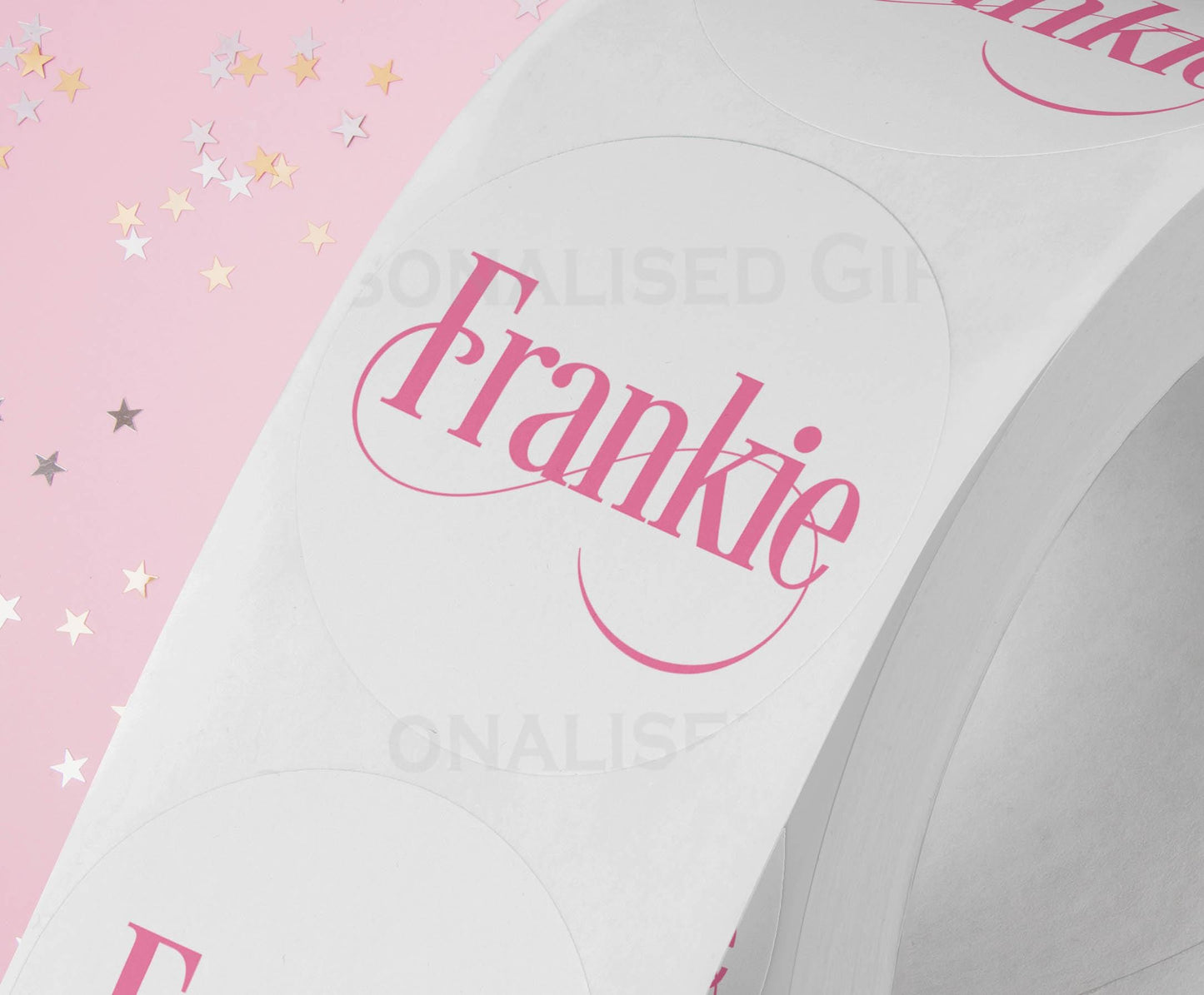 Personalised coloured festive name Christmas stickers styled on gift wrap and party bags, custom name printed
