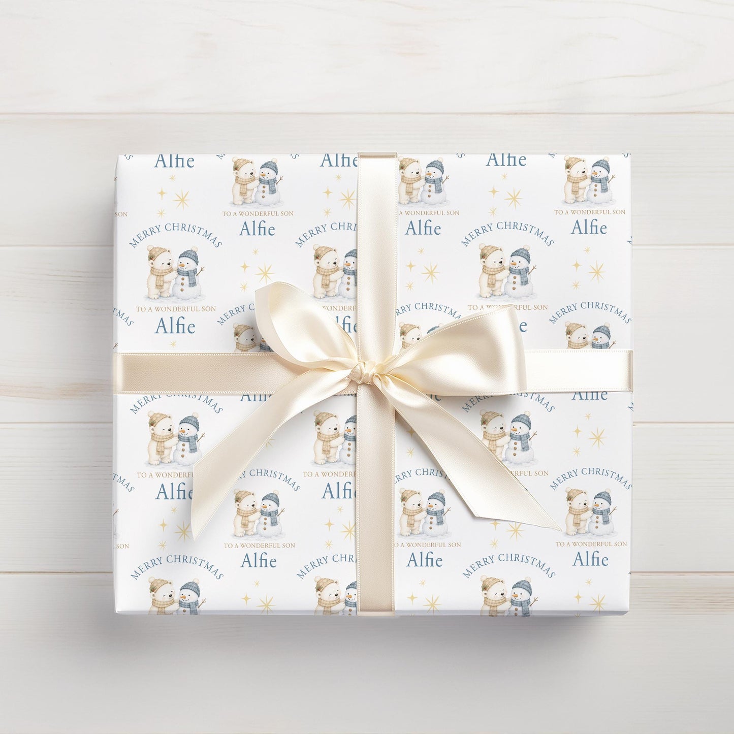 Personalised Christmas gift wrap featuring polar bear and snowman design with custom name, rolled and ready to post