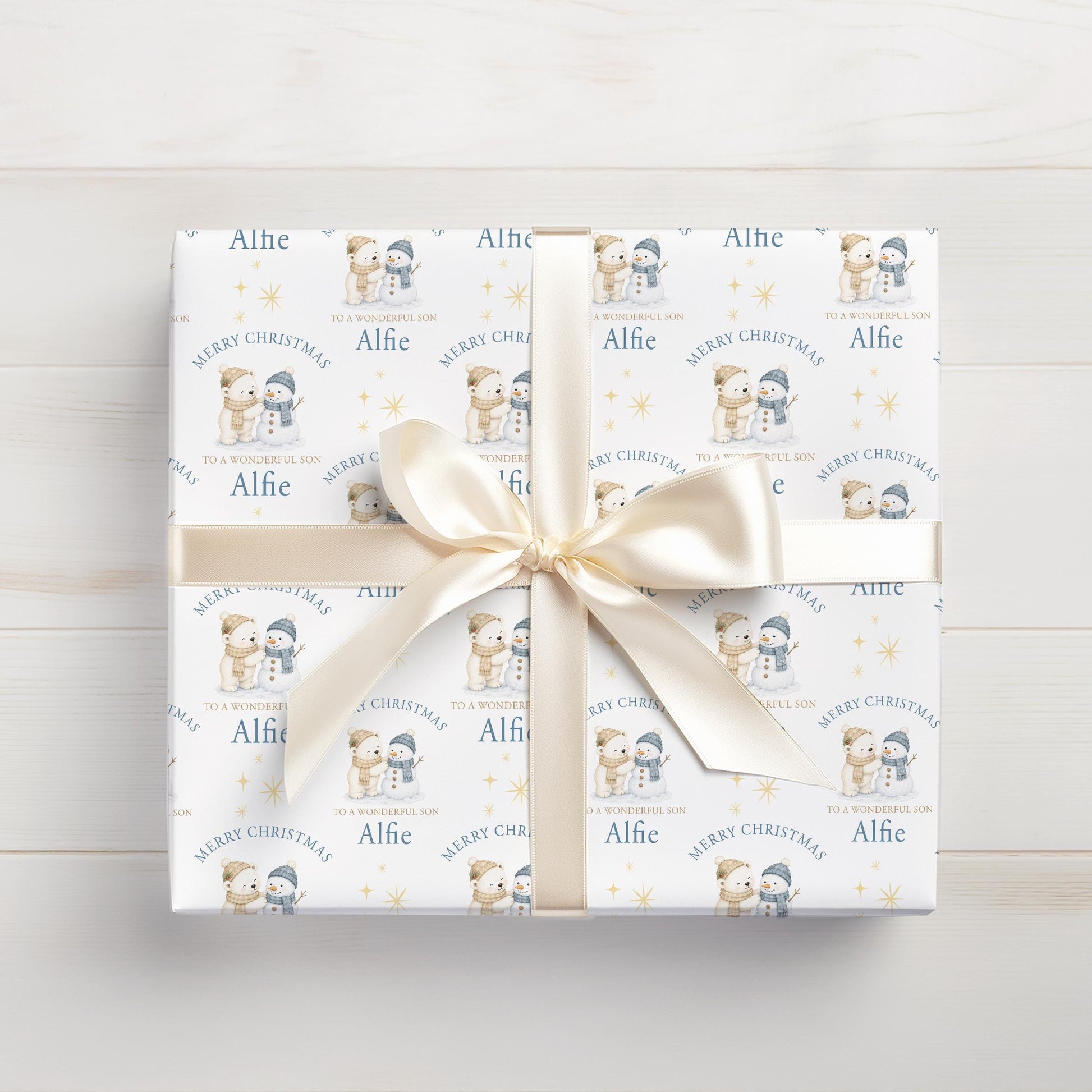 Personalised Christmas gift wrap featuring polar bear and snowman design with custom name, rolled and ready to post