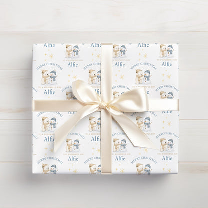 Personalised Christmas gift wrap featuring polar bear and snowman design with custom name, rolled and ready to post
