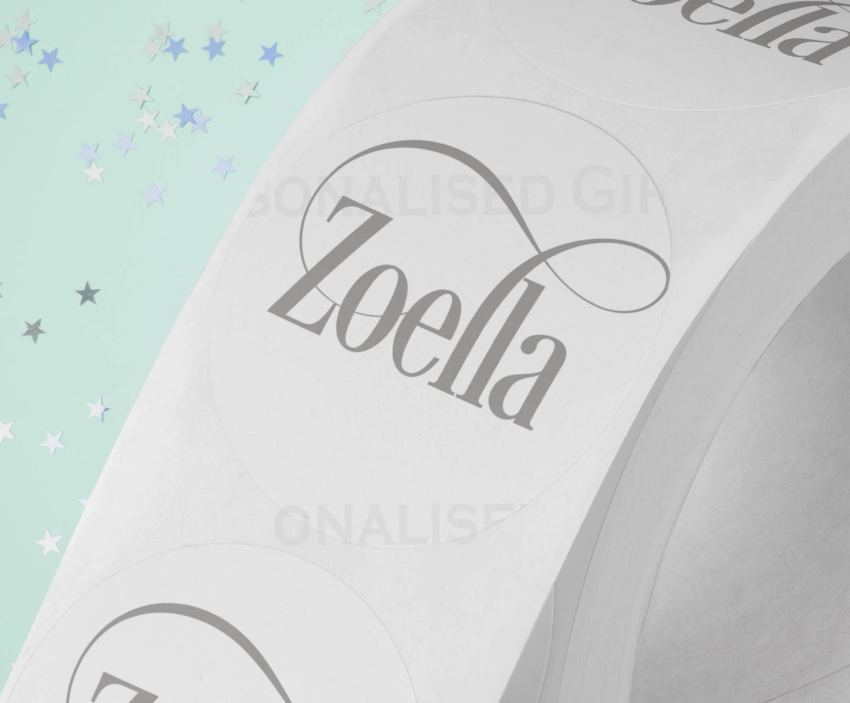 Personalised colourful festive name stickers on an A4 sheet of 24, glossy 4.5cm round gift labels