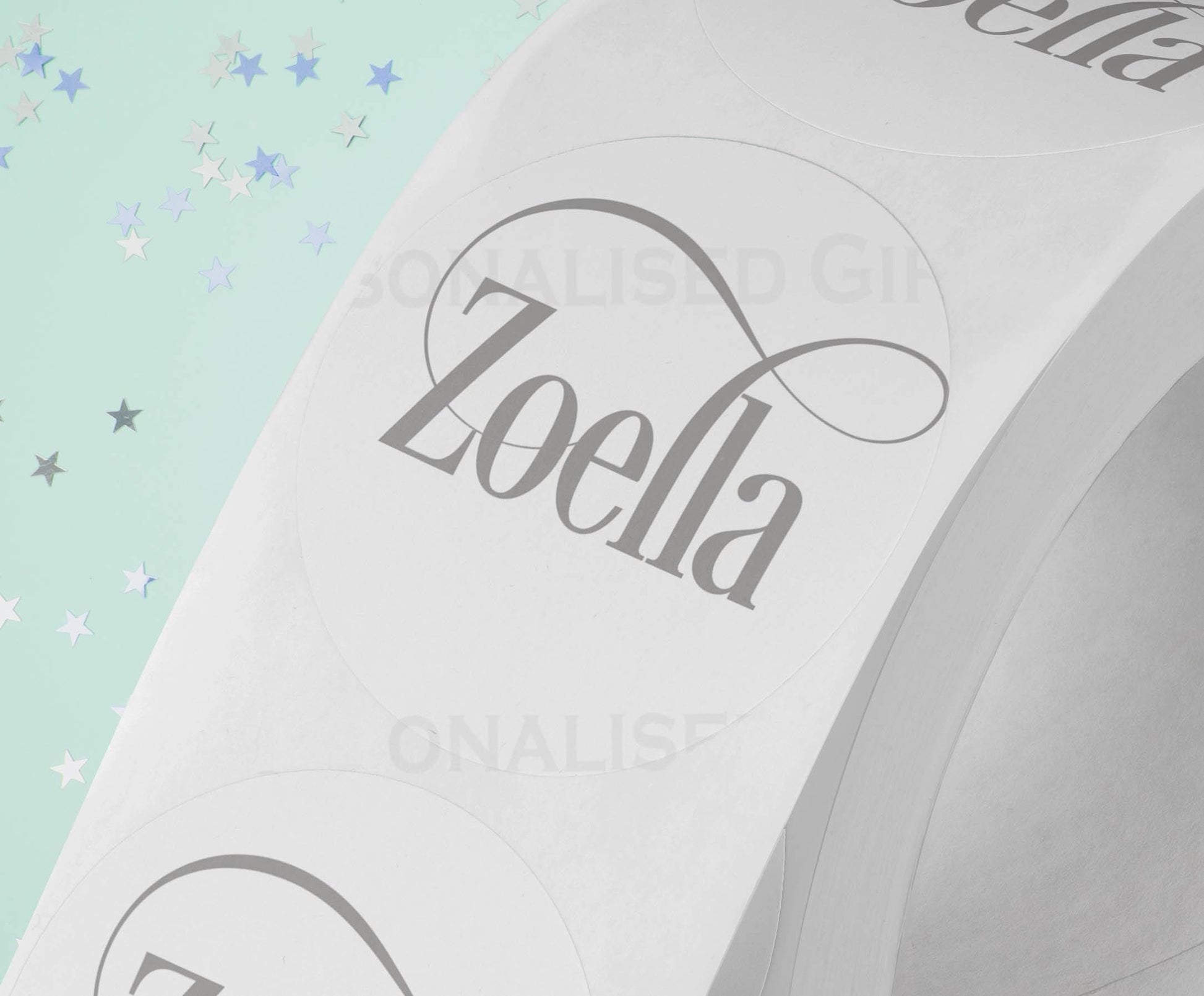 Personalised colourful festive name stickers on an A4 sheet of 24, glossy 4.5cm round gift labels