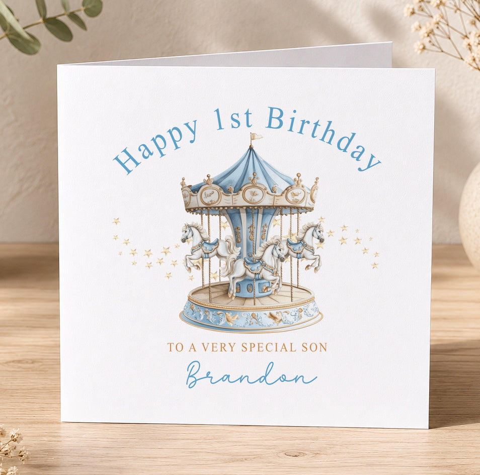 Personalised first birthday card featuring a blue horse and carousel merry-go-round design, printed with a custom name and birthday message.