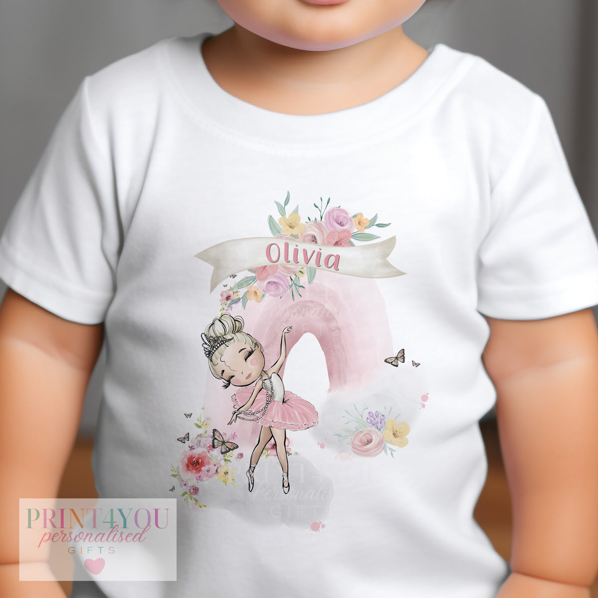 Close-up of the blonde ballerina rainbow design personalised with baby's name.