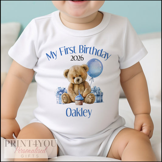 Blue Teddy Bear first birthday vest laid flat on white cotton, ready for personalisation.