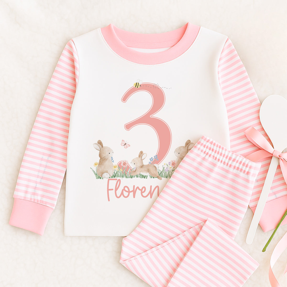 Personalised pink striped pyjamas with Little Hoppy Bunny and age design, size 6-12 months