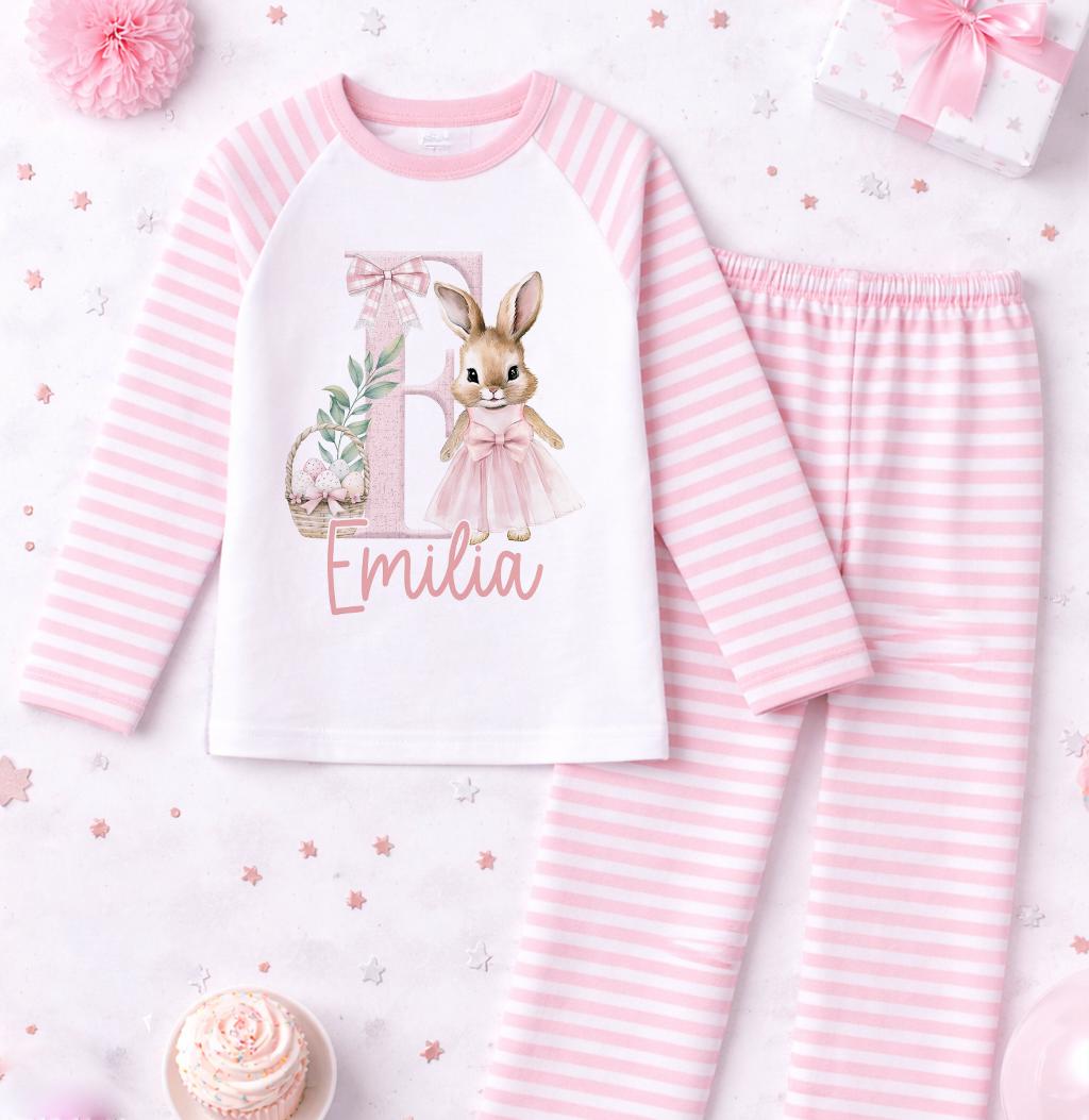 Front view of pink rabbit pyjama set showing the personalised name print