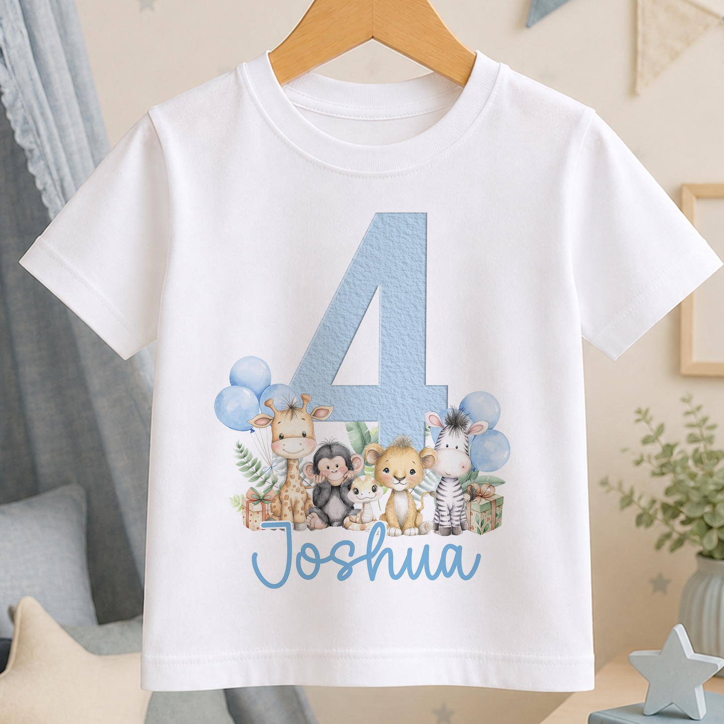 A white t-shirt with a blue number 4 and a design of various animals, including giraffes, zebras, and a monkey, along with the name "James" written below the number.