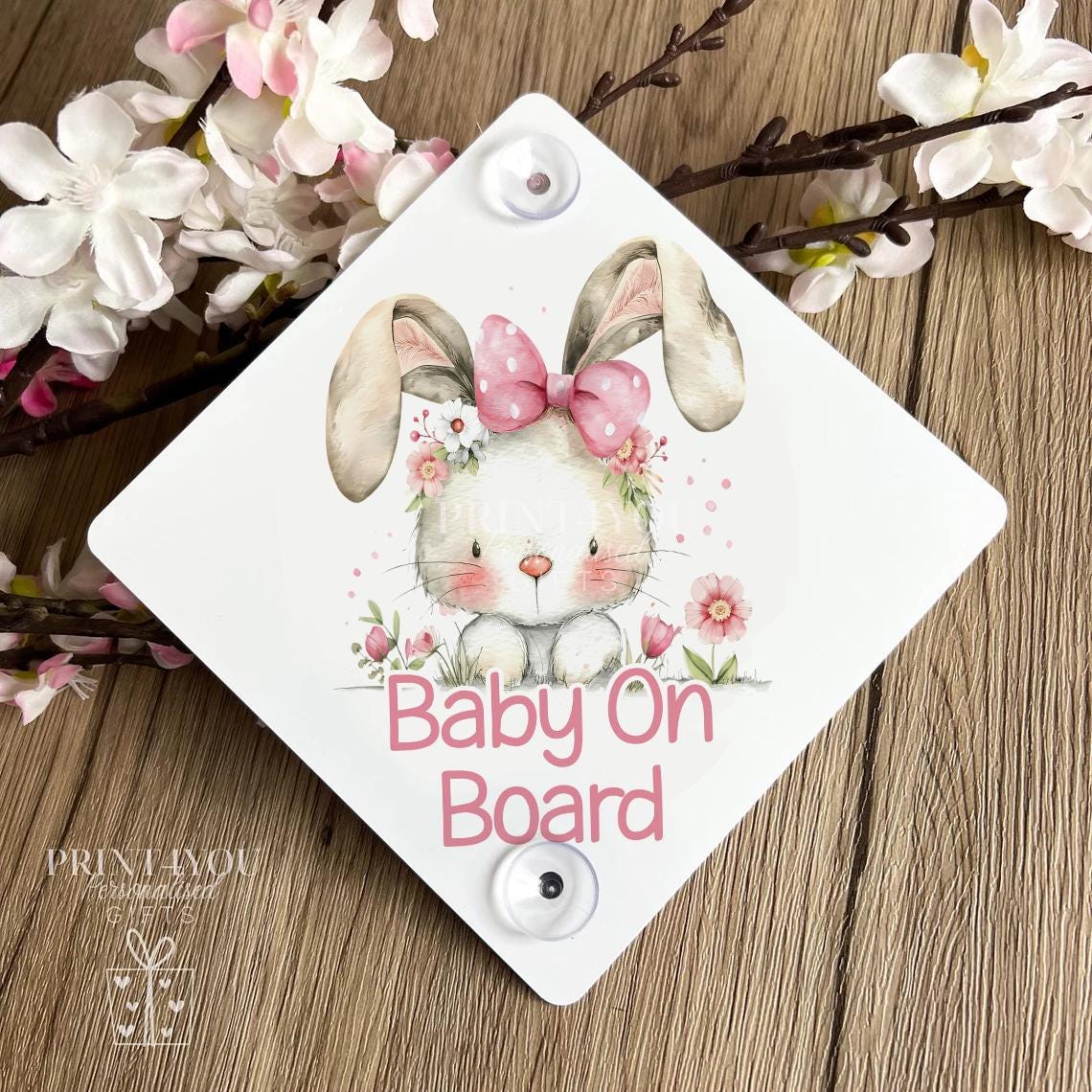Close-up of the baby on board car sign showing the bunny artwork and fixing