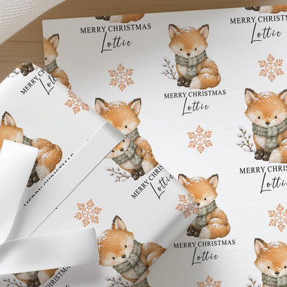 Personalised winter fox Christmas wrapping paper with custom name printed into the repeating design