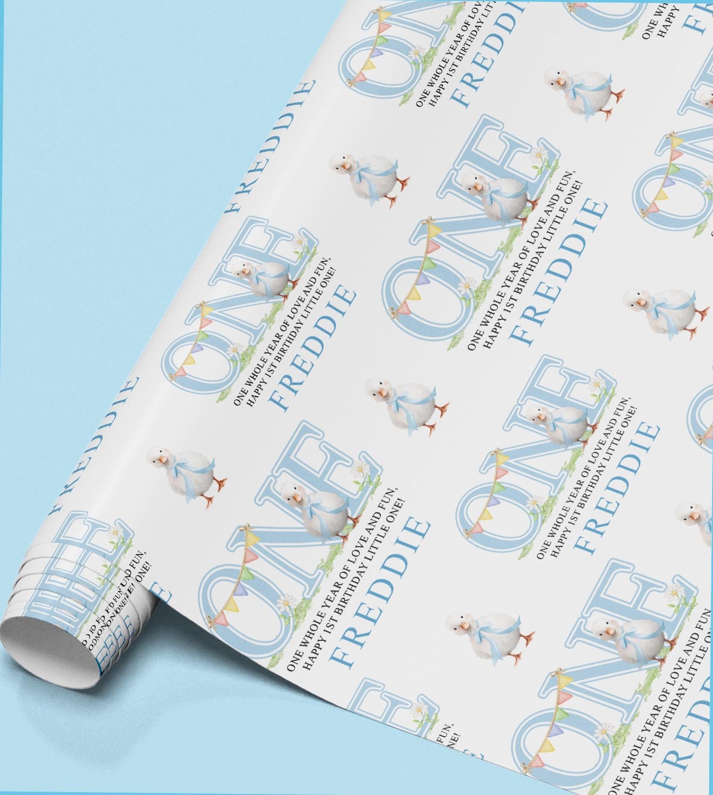 Roll of personalised wrapping paper printed with the name Freddie and a small baby bird illustration.