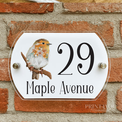a house number sign on a brick wall