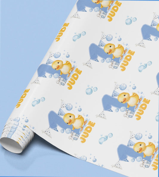 Roll of yellow duck wrapping paper personalised with the name Jude.