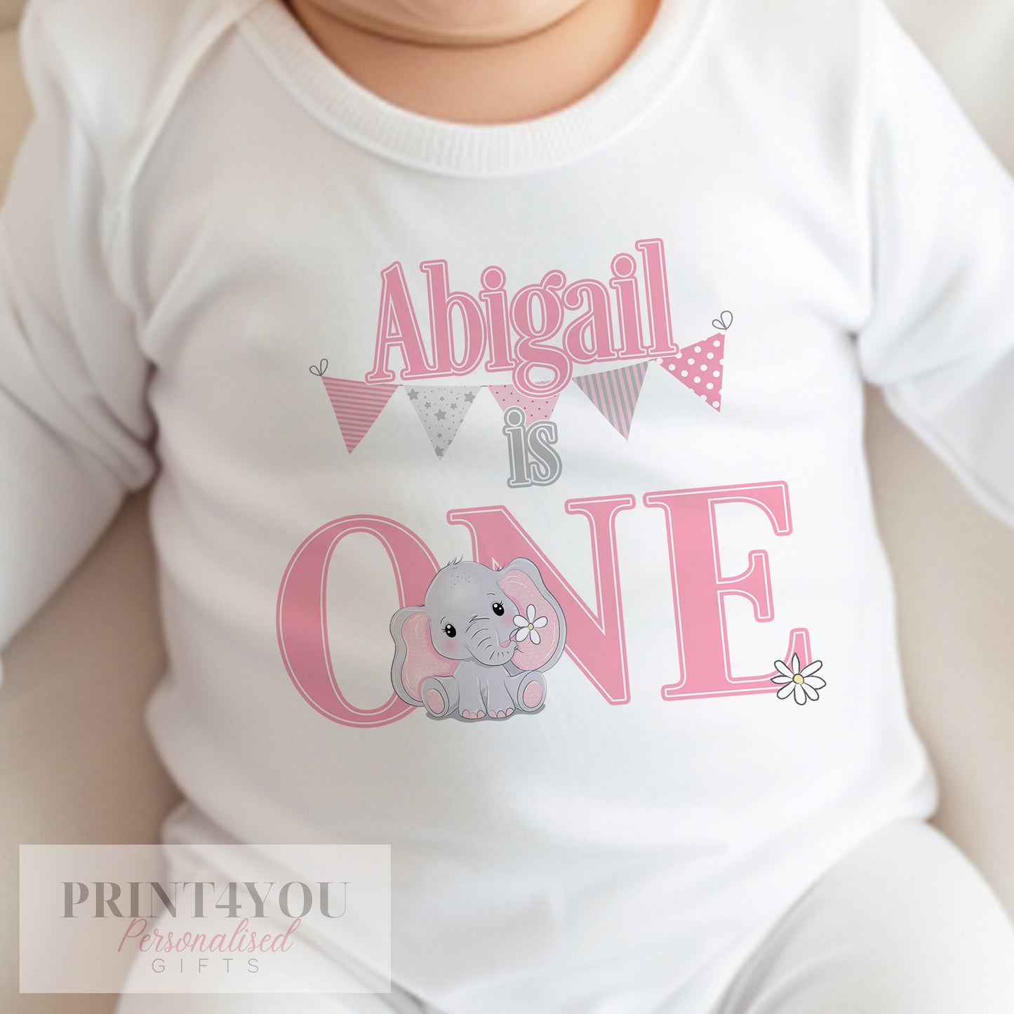 Pink elephant 1st birthday vest, personalised with your baby's name in bold pink lettering.