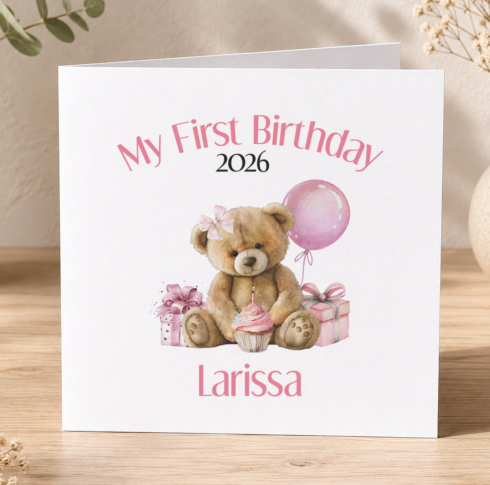 White first birthday card with a teddy bear, a balloon and presents, personalised with the year and the child's name in pink text